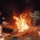 A student protester puts barricades in the path of an already burning armored personnel carrier that rammed through student lines during an army attack on anti-government demonstrators.